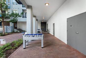 Gaming courtyard with fire pit and water feature